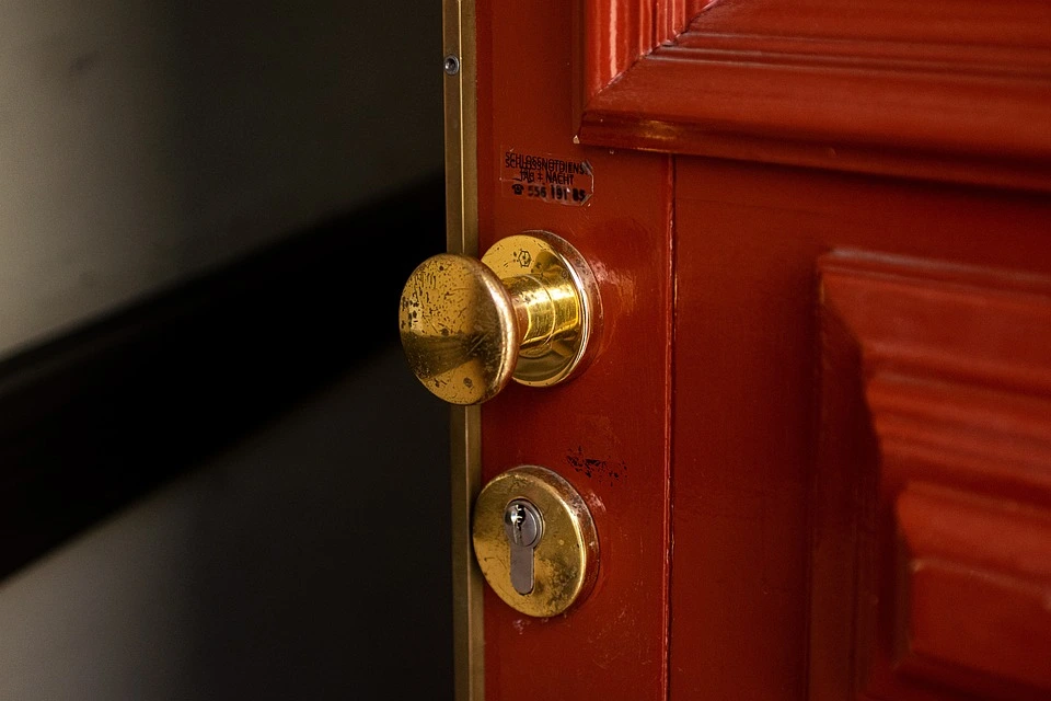 image of an entrance lock on a wooden door